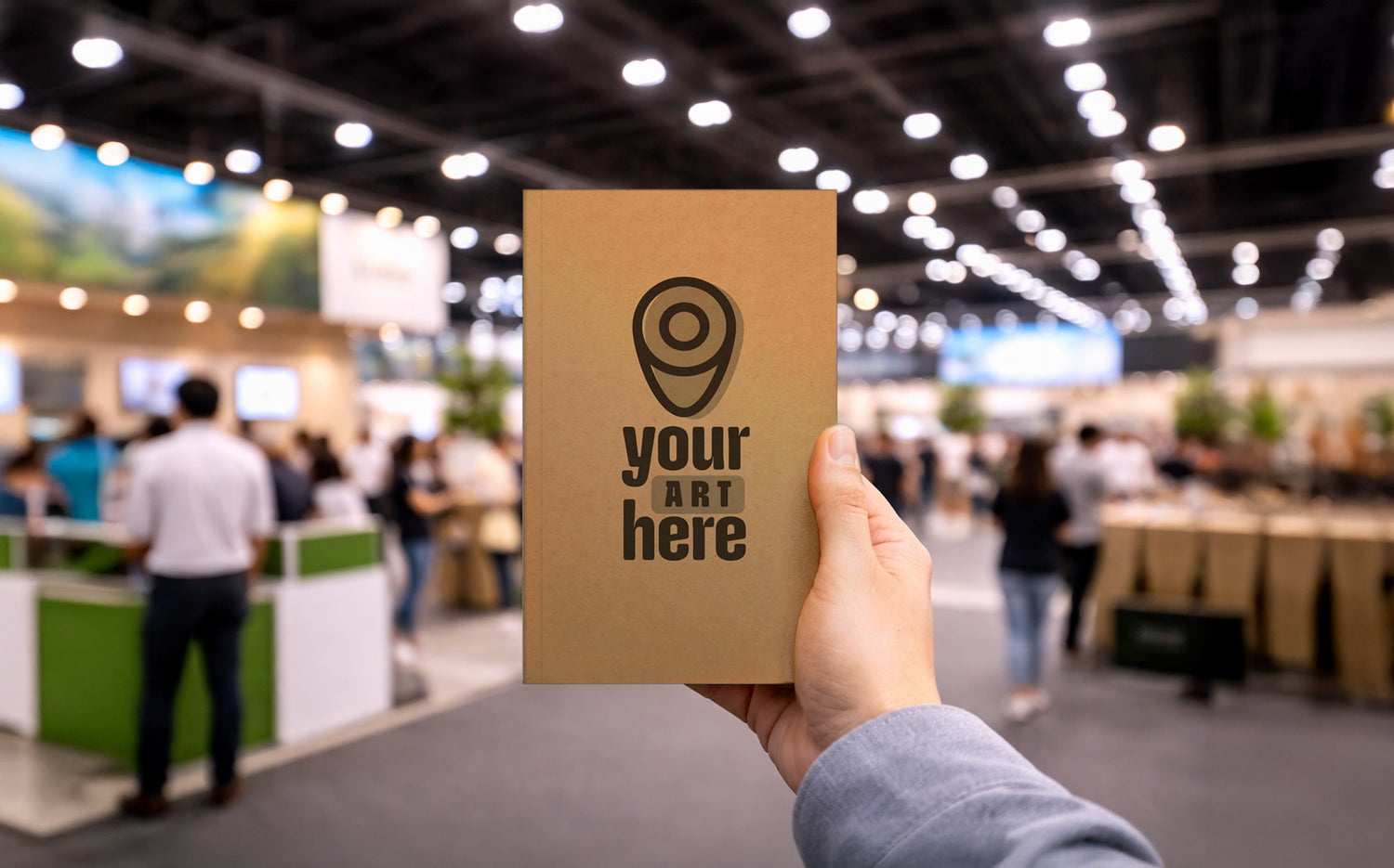 Custom notebook in hand at trade show, notebooks built for business